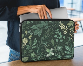 May include: A green laptop sleeve with a floral pattern. The sleeve has a zipper closure and is made of a soft, durable material.