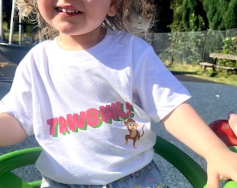 Children's 'Trwbwl!' Welsh Slogan T-shirt in Pink 'TROUBLE' Child tshirt. Little Monkey symbol clothing.