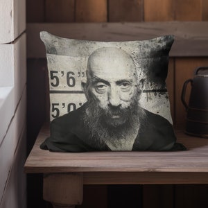 May include: Black and white throw pillow featuring a mugshot style image of a man with a beard. The image includes the text "5'6" and "5'0".