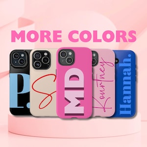 May include: Five different phone cases with personalized names and designs. The cases are in various colors, including black, cream, pink, light pink, and blue. The text on the cases includes "P", "S", "MD", "Courtney", and "Hannah".