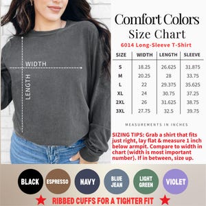 May include: A charcoal grey long-sleeve t-shirt with a Comfort Colors size chart for model 6014. The chart lists width, length, and sleeve measurements in inches for sizes S to 3XL. Color options include black, espresso, navy, blue jean, light green, and violet.