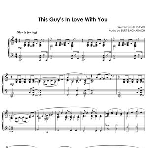 May include: Sheet music for the song "This Guy's In Love With You" by Burt Bacharach and Hal David. The music is written in the key of G major and is in a 4/4 time signature. The lyrics are printed below the music.