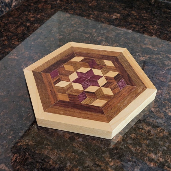 A genuinely exotic wood mashup — Purple Heart's deep violet grain sliced alongside Maple, Rosewood, and Angelique makes a cutting board that's basically wall art you can also chop cheese on.