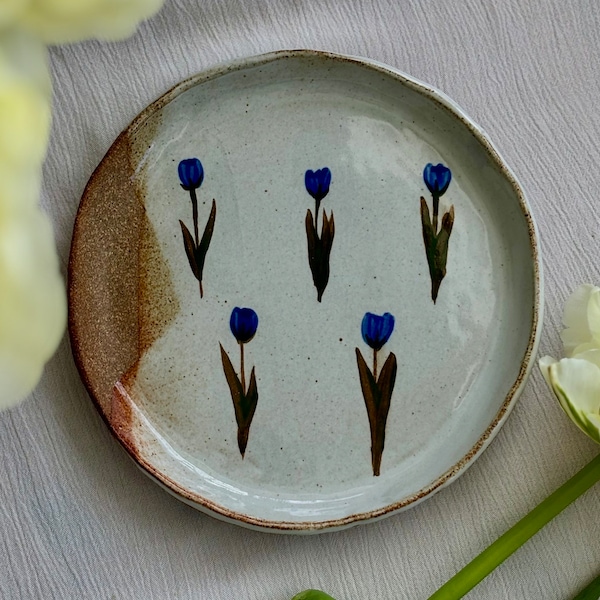 Handmade hand drawing plate with tulips
