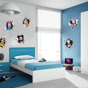 May include: A set of six wall decals featuring colorful cartoon characters including Mickey Mouse, Minnie Mouse, Goofy, Pluto, Donald Duck, and Daisy Duck, each depicted as if emerging through a cracked hole in the wall surface.