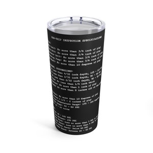 May include: Black tumbler with a silver lid, featuring white text detailing pre-trip inspection specifications. The text includes measurements in inches and degrees. A practical and informative item.