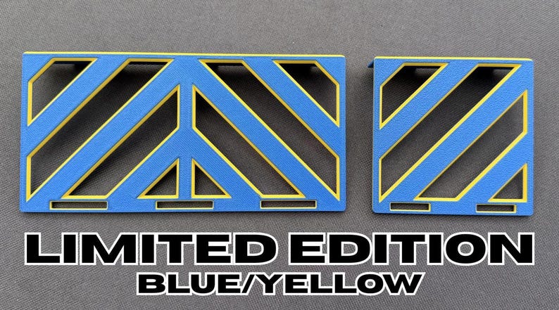 May include: Two blue and yellow geometric shapes with a peace sign design. The text "LIMITED EDITION BLUE/YELLOW" is displayed below the shapes.