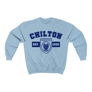 May include: Light blue sweatshirt with a navy blue crest and the text "Chilton Est. 1803" printed on the front.