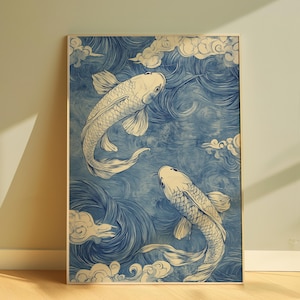 May include: A framed print of two blue and white koi fish swimming in a blue and white wave pattern. The background is a light blue with white clouds.