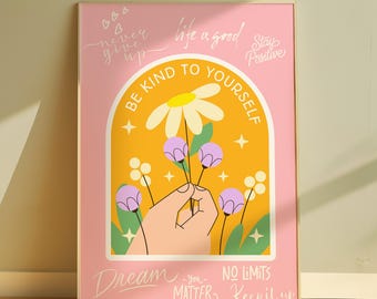 May include: A framed pink poster with the words "Be Kind To Yourself" in a yellow arch. The poster features a hand holding flowers, with the phrases "Never Give Up", "Life is Good", "Stay Positive", "Dream", "No Limits", and "Keep it Up".