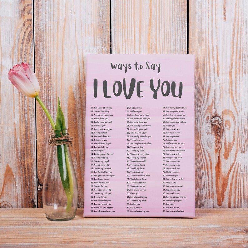 May include: A pink and white canvas print with the text "Ways to Say I Love You" and a list of 90 different ways to say "I Love You".