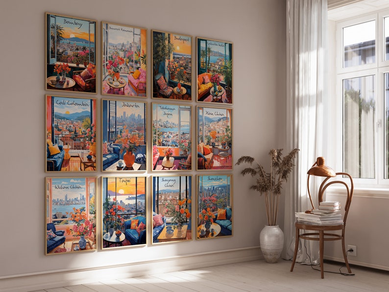 May include: A collection of twelve framed art prints, each depicting a vibrant city scene viewed from a balcony or interior space. The prints feature colorful floral arrangements, furniture, and city names like Bombay and Taipei.