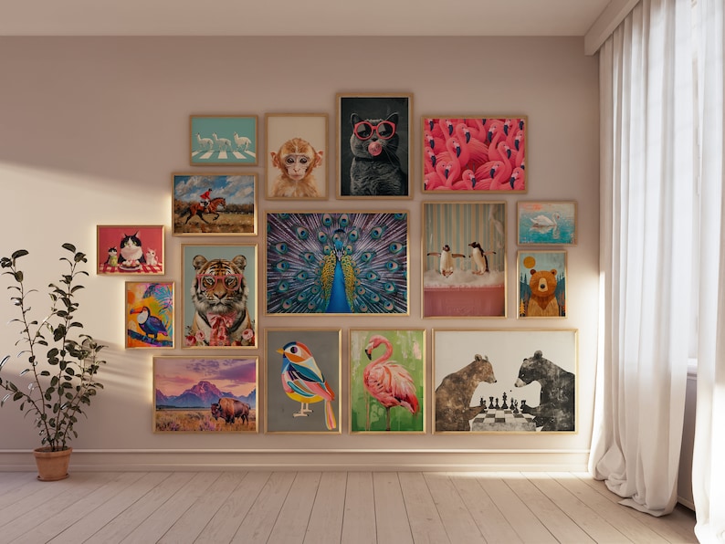May include: A gallery wall with a variety of framed prints featuring animals, including a peacock, a tiger, a flamingo, a toucan, a monkey, and a bear. The prints are arranged in a grid pattern on a light pink wall.