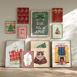 May include: A collection of framed Christmas-themed art prints. The prints feature various designs, including Christmas trees, a cat with lights, and festive text like "Hello December" and "My Dog Ate All My Christmas Decor."