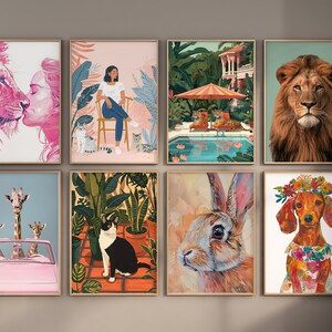 May include: A set of 8 framed art prints featuring various animals and scenes. The prints include a pink lion, a giraffe family in a pink car, a cat in a jungle, a rabbit, a dachshund with a flower crown, a woman with a cat, a lion, and a tropical scene with a pool.