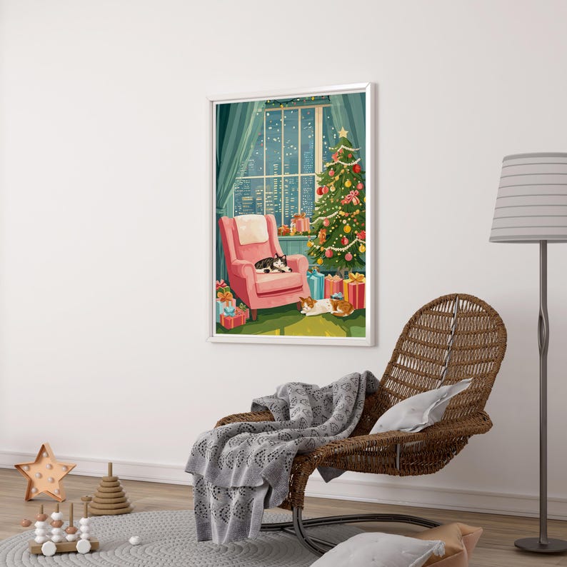 May include: A framed illustration depicts a cozy Christmas scene. A pink armchair sits by a window with a city view, a decorated tree, and wrapped gifts. Two cats are resting in the room. The artwork is displayed on a white wall.