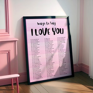 May include: A pink and white printable poster with the text "Ways to Say I Love You" and a list of 100 different ways to say "I love you".