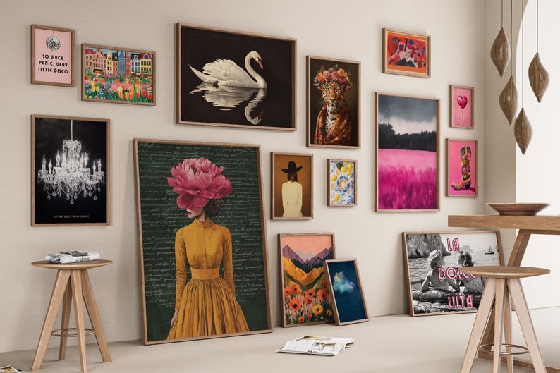 May include: A gallery wall featuring various framed art prints including a swan, a chandelier, a person with a large pink flower head, a leopard, a pink landscape, a cowboy boot, and a black and white beach scene with the text La Dolce Vita.