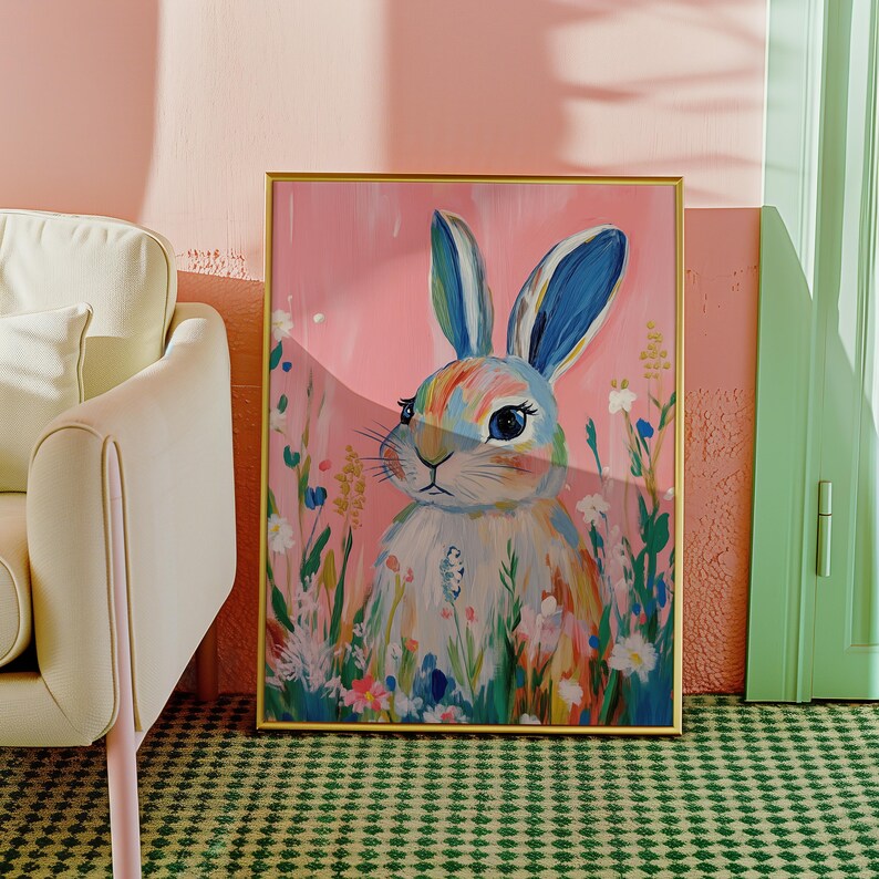 May include: A colorful painting of a rabbit with blue ears and a rainbow-colored body. The rabbit is surrounded by flowers and greenery, and the background is a soft pink.
