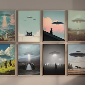 May include: A collection of eight framed art prints featuring surreal scenes with UFOs. Each print showcases a different landscape with a flying saucer, some with figures, cats, and atmospheric effects like rainbows and fog.
