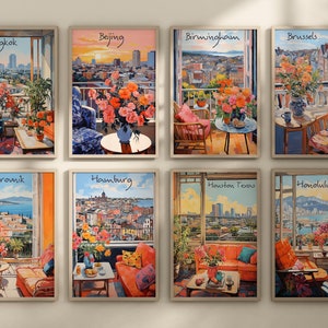 May include: Set of eight framed art prints featuring city views from balconies, each with a different city name: Bangkok, Beijing, Birmingham, Brussels, Dubrovnik, Hamburg, Houston Texas, and Honolulu. The artwork showcases colorful flowers and furniture.