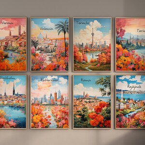 May include: Nine framed art prints featuring colorful illustrations of various cities around the world. Each print has a white background with the city name written in black at the top. The prints are arranged in three rows of three.