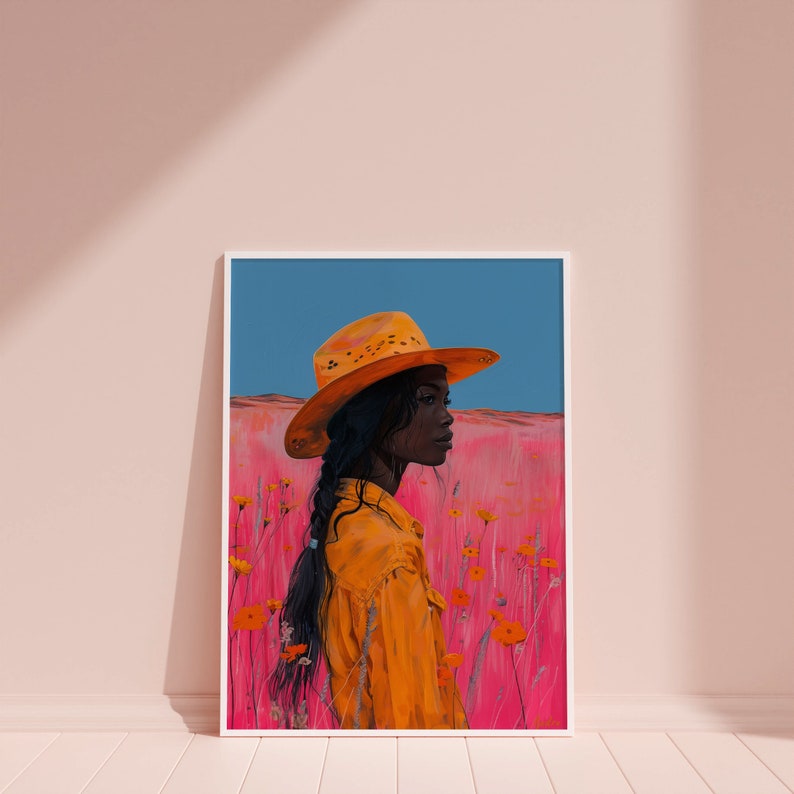 May include: A painting of a person wearing a yellow cowboy hat standing in a field of pink flowers. The person is looking off to the side and has dark skin and long black hair.