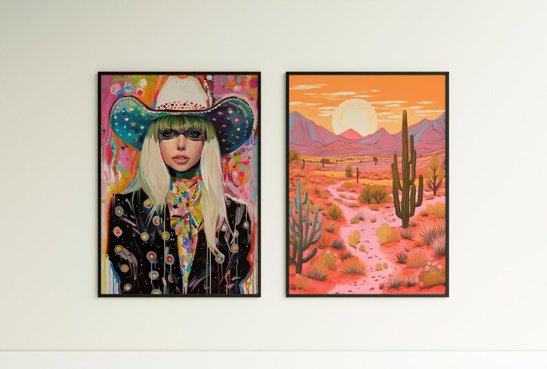 May include: Two framed art prints. The print on the left features a woman wearing a colorful cowboy hat and a black leather jacket. The print on the right features a desert landscape with a large cactus in the foreground.