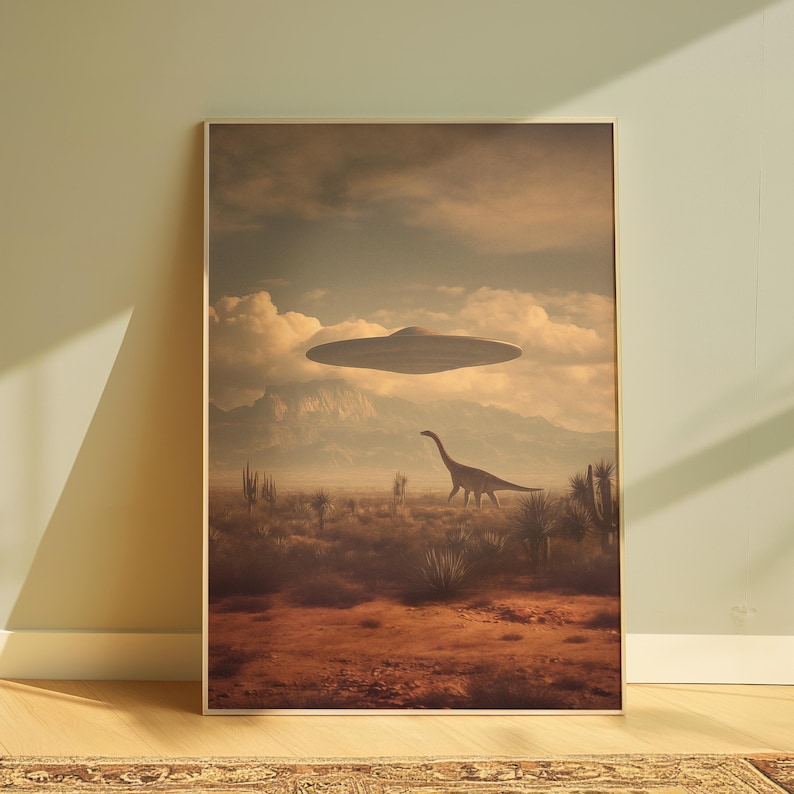 May include: A framed art print depicts a surreal desert landscape. A Brontosaurus walks across the foreground, with a UFO hovering in the sky. The color palette is muted, with browns, tans, and blues dominating the scene.