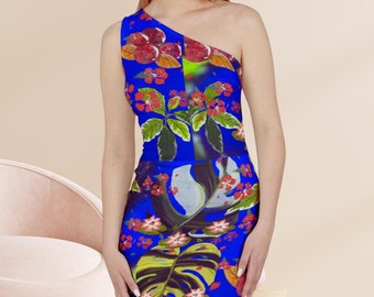 May include: A blue one-shoulder dress with a floral print featuring tropical leaves, flowers, and birds. The dress has a fitted silhouette and a knee-length hem.