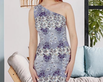 May include: A one-shoulder dress with a fitted silhouette and a gray background. The dress features a pattern of white and silver diamonds.