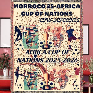 May include: A woven tapestry featuring a soccer theme with the text "MORROCO 25-AFRICA CUP OF NATIONS CFW-AFCON25 AFRICA CUP OF NATIONS 2025-2026". The tapestry features a tree with soccer balls, players, and trophies.