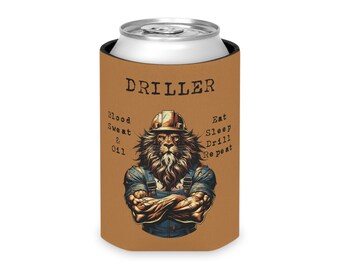 May include: A brown can cooler with a lion wearing a hard hat and overalls. The text "DRILLER" is at the top of the cooler. The text "Blood Sweat & Oil" is on the left side of the cooler. The text "Eat Sleep Drill Repeat" is on the right side of the cooler.