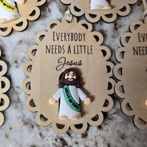Everybody needs a Little Jesus Wooden ornament