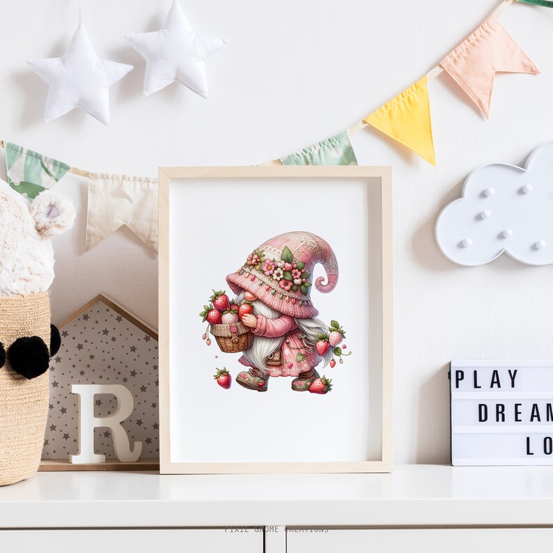 May include: A framed print featuring a whimsical gnome illustration. The gnome, dressed in pink and adorned with flowers, carries a basket of strawberries. The artwork is set against a white background, with decorative elements like stars and a banner.