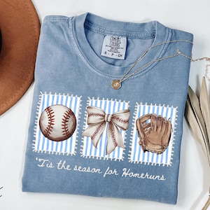 Comfort Colors® Blue Jean shirt with vintage-style baseball illustrations and “’Tis the season for homeruns” text, ideal for baseball moms.