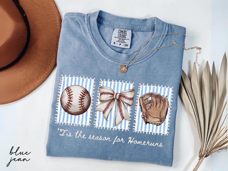 Comfort Colors® Blue Jean shirt with vintage-style baseball illustrations and “’Tis the season for homeruns” text, ideal for baseball moms.