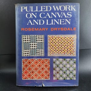 May include: A vintage book titled "Pulled Work on Canvas and Linen" by Rosemary Drysdale. The cover is blue with white text and features four colorful stitched patterns. The book's cover is slightly worn.