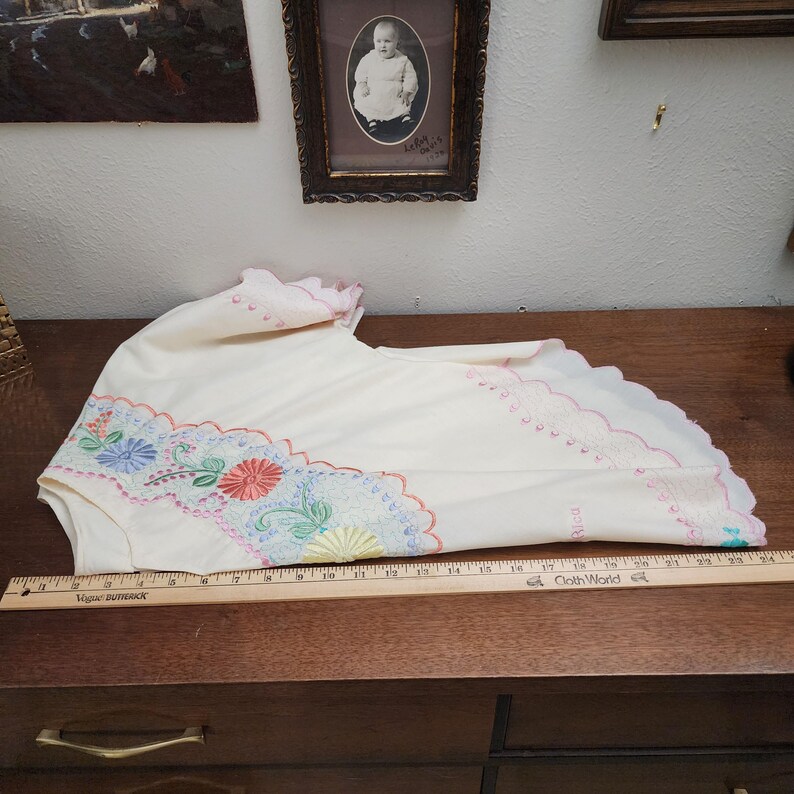 May include: A set of three ceramic vases in varying heights. The vases are white with a textured, ridged design. The tallest vase is approximately 10 inches tall, the medium vase is 8 inches, and the smallest is 6 inches.