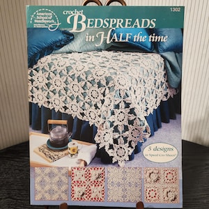 May include: A book cover featuring a crocheted bedspread over a bed with blue pillows and a skirt. The title reads "Bedspreads in Half the Time" with the American School of Needlework logo. Five bedspread designs are shown.