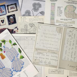 May include: A collection of cross-stitch patterns featuring a variety of designs, including a floral pattern, a bird pattern, and a quote that reads "Like the stars have touched the moonlit sky, you have touched our lives in a thousand ways."