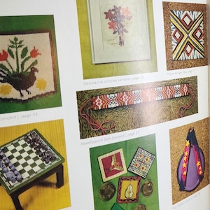 May include: A page from a craft book featuring various needlepoint projects. The image showcases a sampler with flowers, a framed floral design, a geometric pillow design, a needlepoint belt, and other small decorative pieces. The color palette includes reds, yellows, and greens.