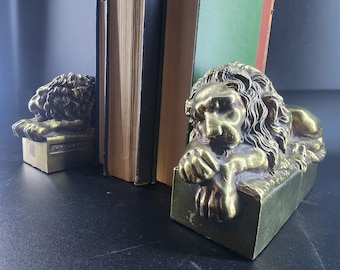 Pair of Cast Brass Lion Bookends with Antonio Canova named, vintage bookends from the art deco era 1940