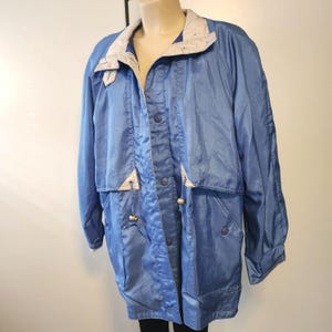 L vintage 90s shiny light blue with silver accents collared button up windbreaker jacket size large by Current Seen, hip wind breaker