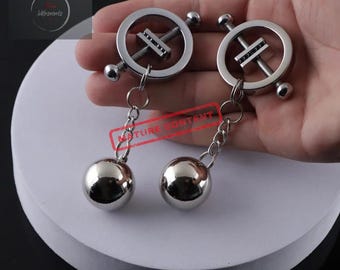 Verstellbare Nippelklammern aus Metall mit auswechselbaren Gewichten in Kugelform