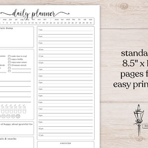May include: A white daily planner page with black text featuring a calendar header, a brain dump section, a checklist, a to-do list, a water intake tracker, a mood tracker, an hourly schedule from 7 am to 11 pm, and text stating standard 8.5" x 11".