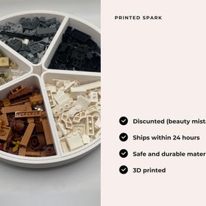May include: A white circular tray with five compartments, each filled with a different colour of Lego bricks. The colours are black, grey, brown, white, and tan. The tray is labelled "PRINTED SPARK" and has a list of features: "Discounted (beauty mistakes)", "Ships within 24 hours", "Safe and durable materials", and "3D printed".
