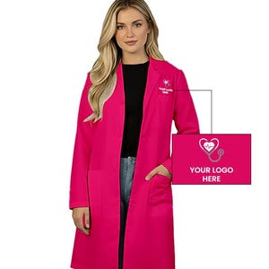 May include: A bright pink lab coat featuring a notched lapel, long sleeves, and two front patch pockets. The left chest area displays a white graphic of a heart-shaped stethoscope with the text YOUR LOGO HERE, also shown in a larger inset box.