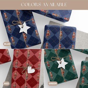 May include: Wrapping paper featuring a repeating nutcracker pattern on blue, red, and green backgrounds with a diamond grid. The paper is tied with twine and includes white star or heart-shaped gift tags. Text reads COLORS AVAILABLE.