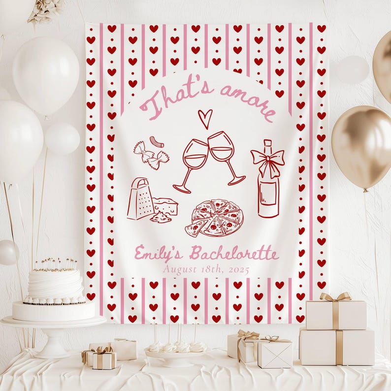 May include: A white bachelorette party banner with pink and red hearts and stripes. The banner says "That's amore" and "Emily's Bachelorette August 18th, 2025". There are illustrations of wine glasses, a bottle of wine, a pizza, and pasta.